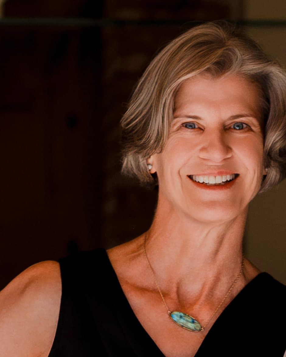 Kim Sinclair in the front doorway of Kismet